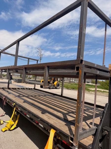 Flatbed load secured on trailer — Jusczak Logistics carrier partner